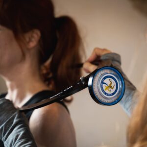 Julie Tod of Your Peak Potential performing a consultation on a client